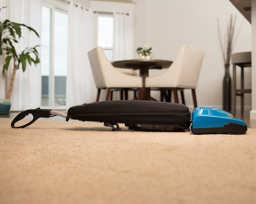Vacuum cleaner demonstrating its flat-lay capability.