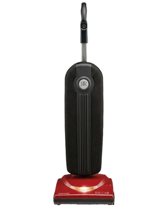 Upright vacuum cleaner with red base and black body on a white background