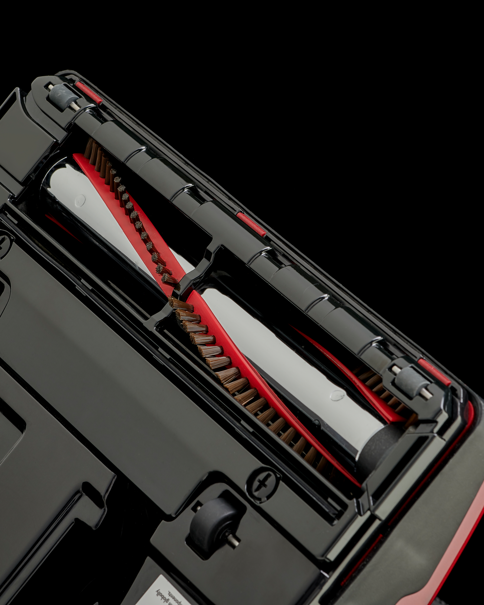Close-up of a Riccar R10P metal brushroll with removable brushstrips.