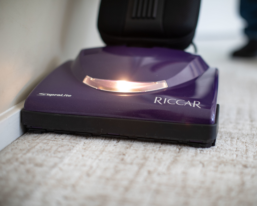Purple Riccar vacuum cleaner on a carpet
